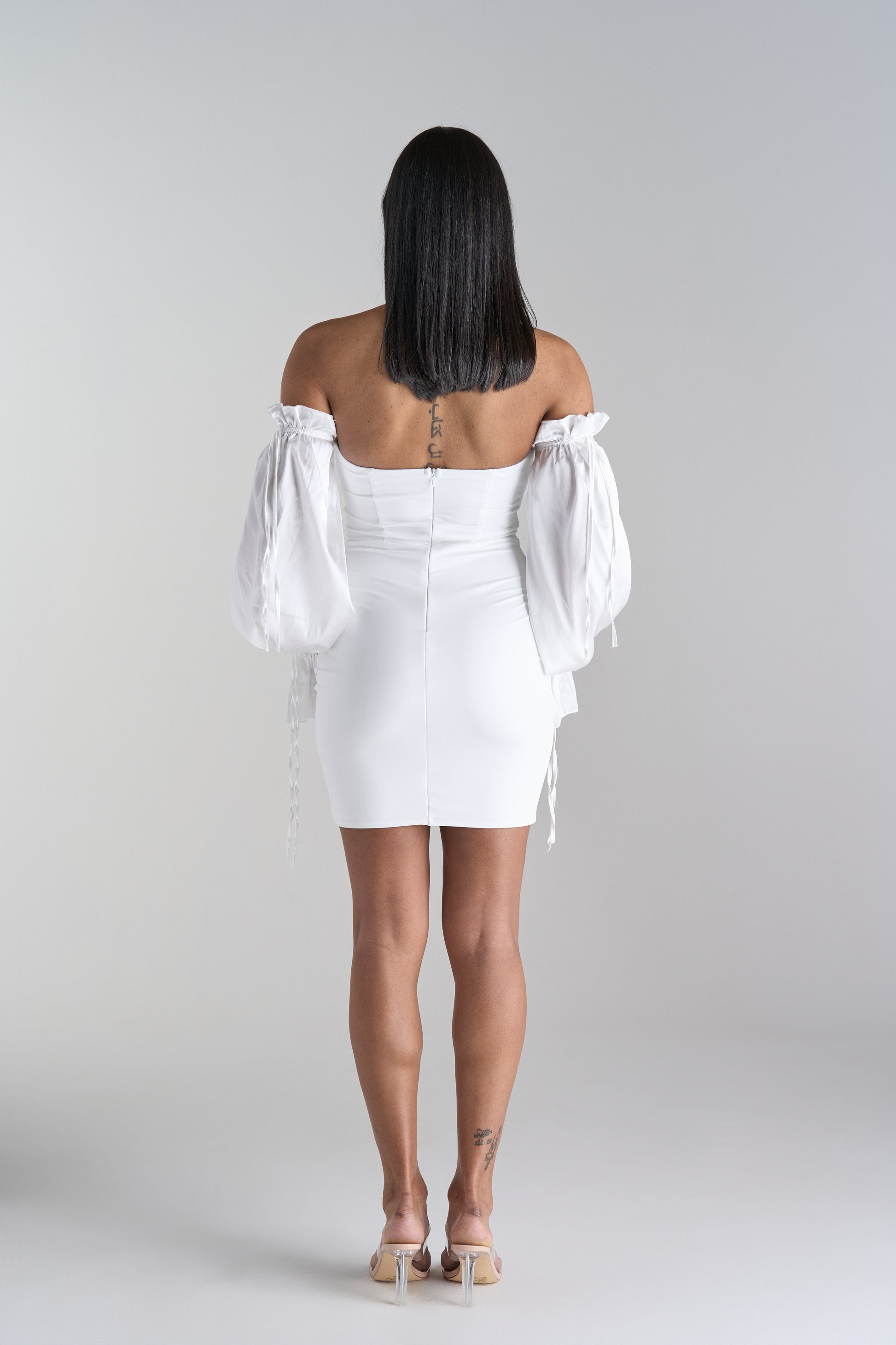 Model Wearing Off Shoulder White Mini Dress