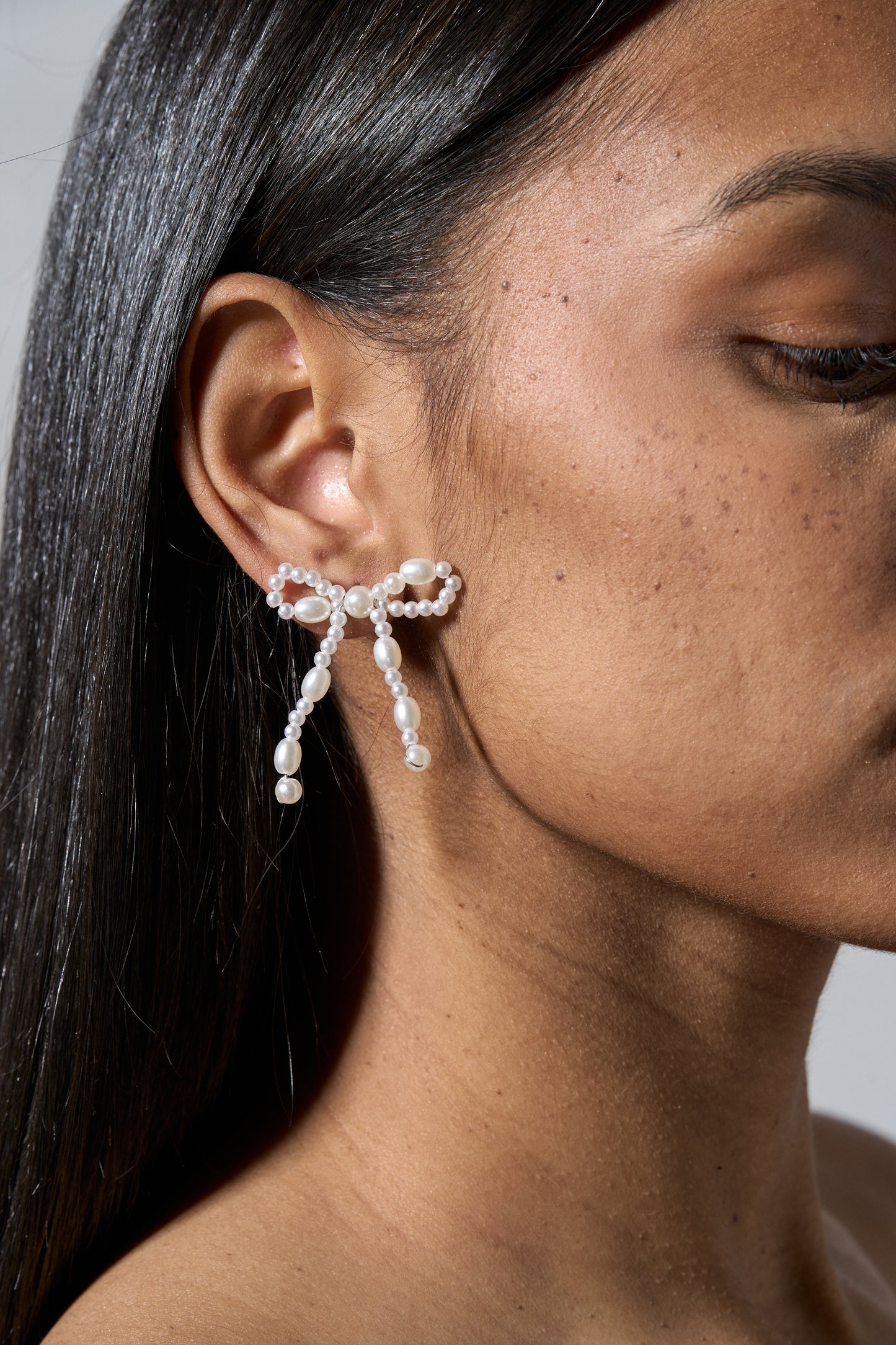 Model Wearing Bow Earrings