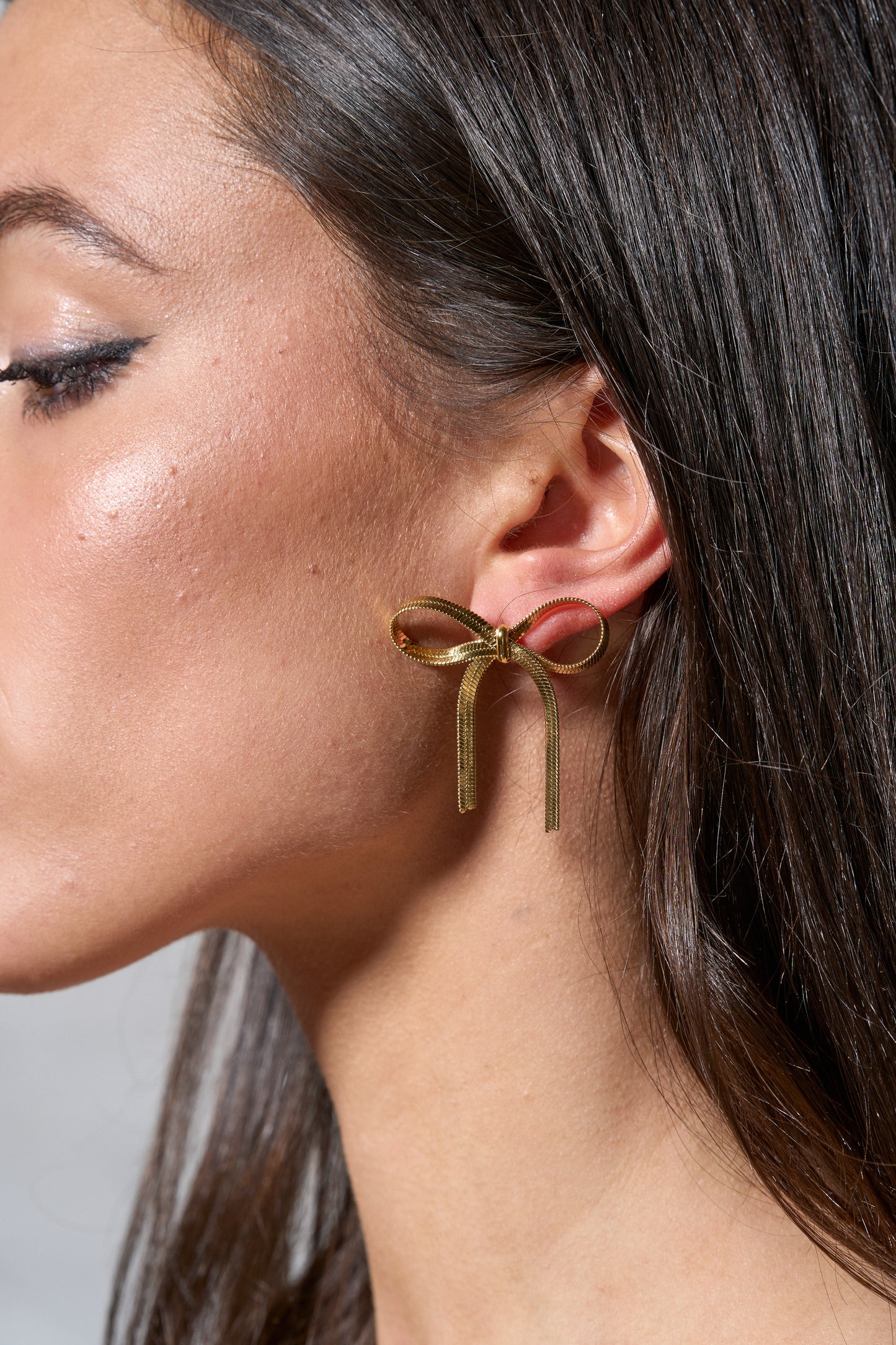 Gold Bow Earring on Model