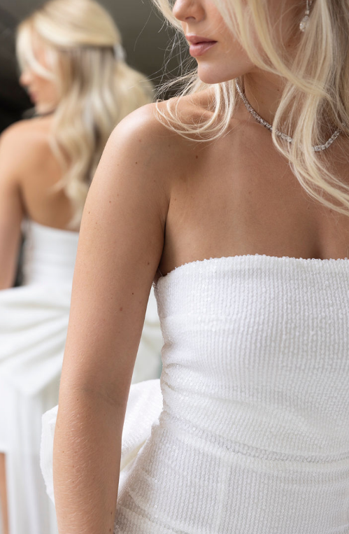 Girl Wearing Model wearing mini dress with big bowWhite Dress