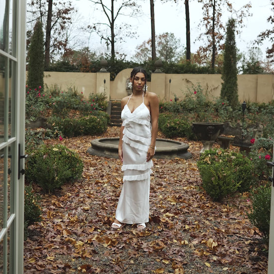Video of Model in Ruffled White Gown out in a Garden 